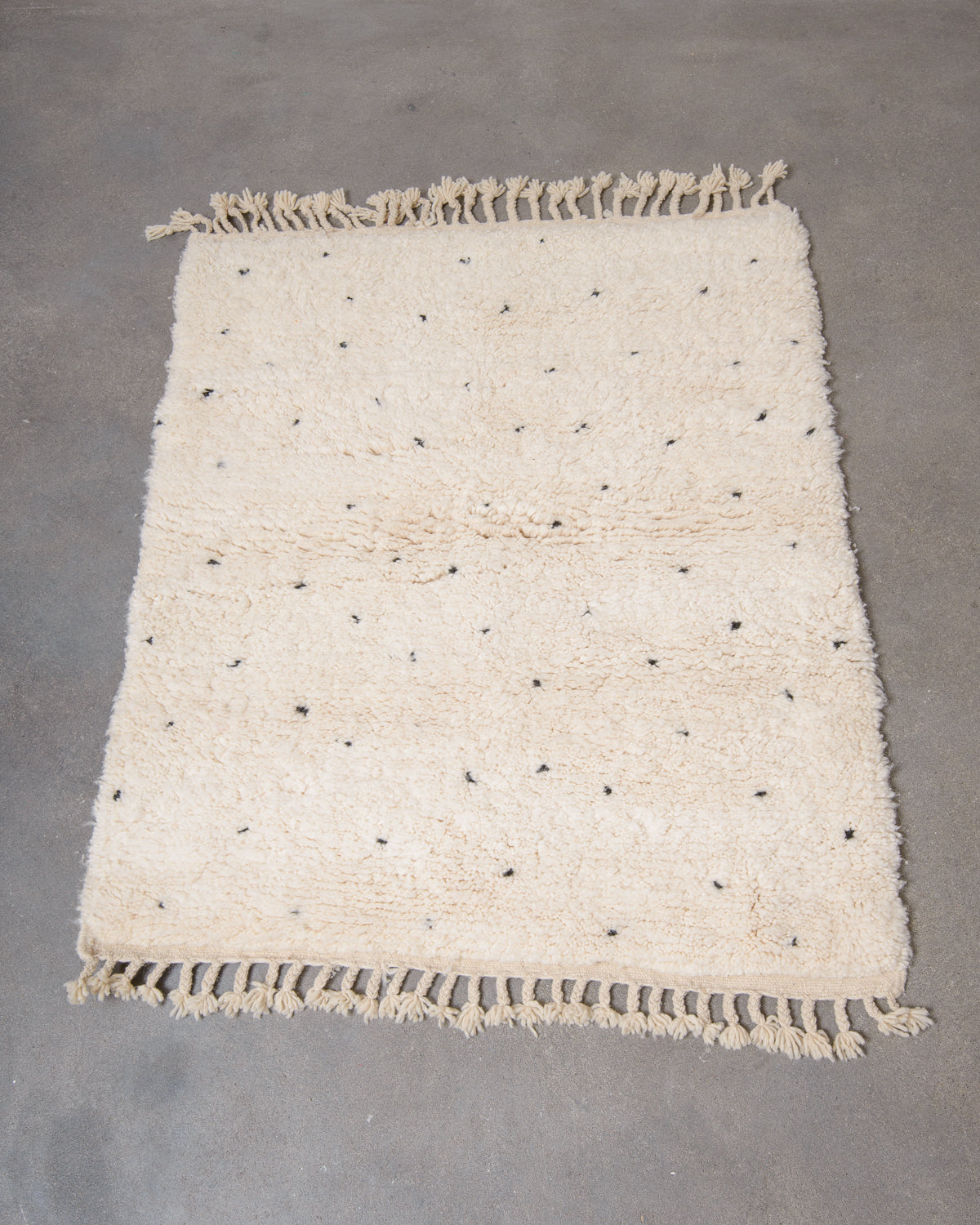 Modern, designer, handcrafted Berber rug from Morocco. Beniourain carpet with minimalist design, natural wool pile and a fluffy texture.